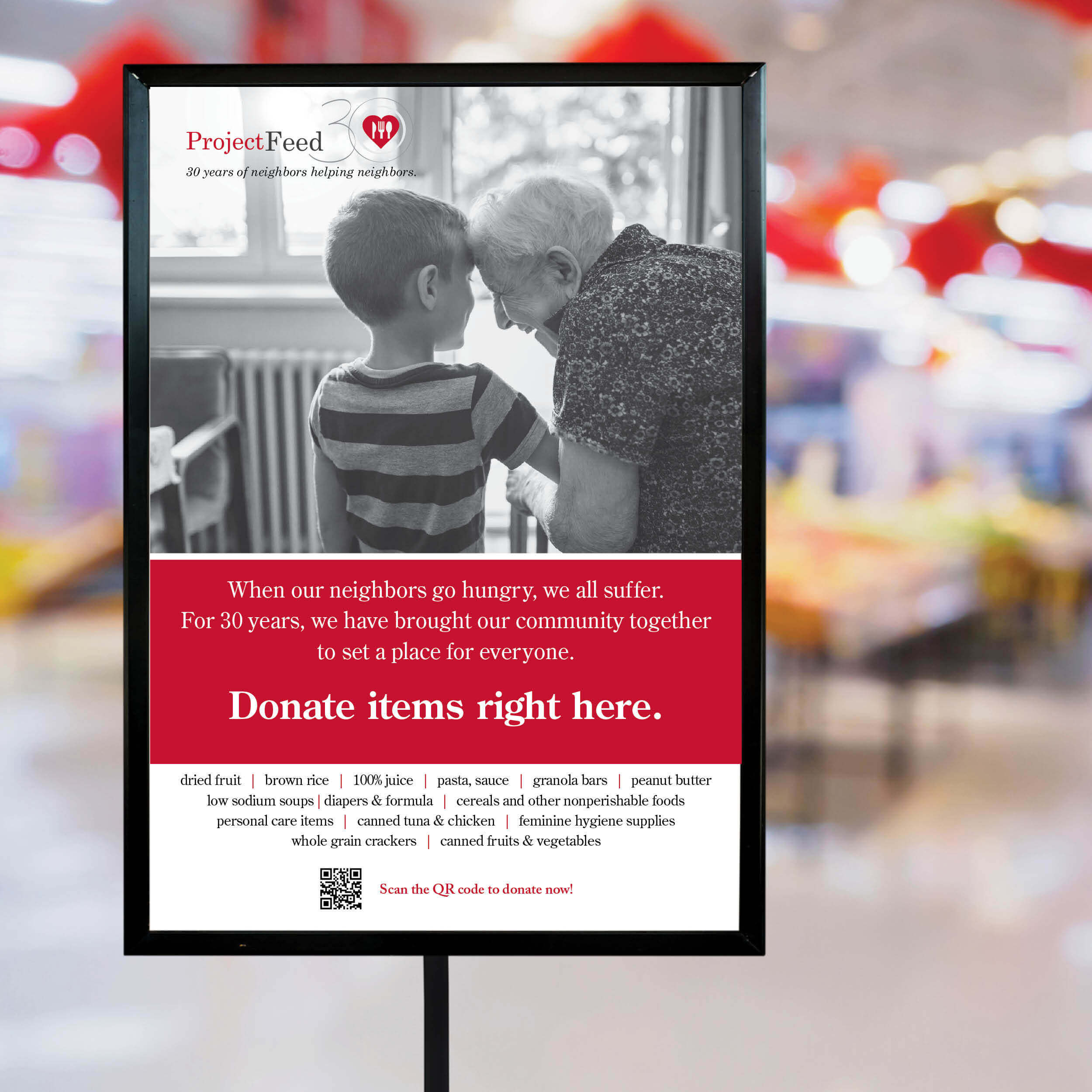 Project Feed the Thousands Poster in Stand